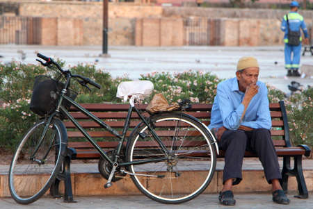 Marrakech, Morocco, July 27, 2019. A man takes a break during the morning in a city park.のeditorial素材