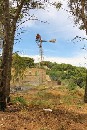 windmill landscape with fireの写真素材