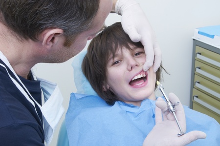 boy during a dental visit. doctor's clinicの写真素材
