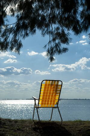 chair alone watching the water