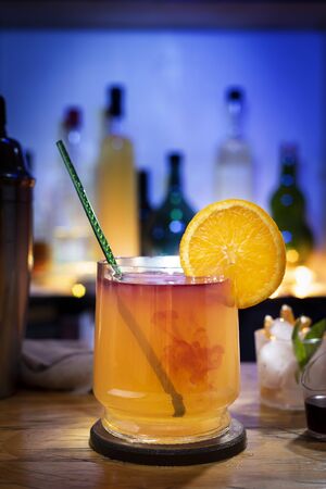 shot of orange and liquor on bar counterの写真素材