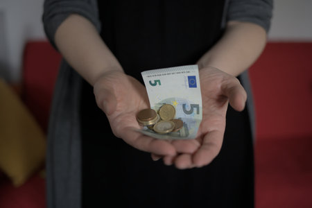 Woman shows euro money in her handの写真素材