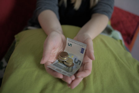 Woman shows euro money in her handの写真素材