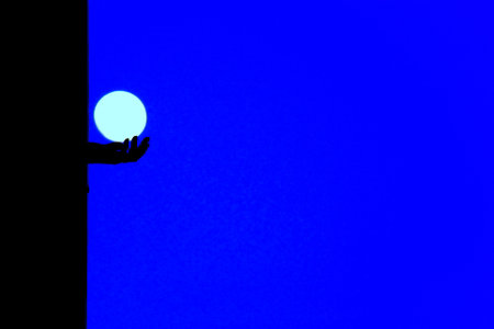 Abstract illustration of ball held in handの写真素材
