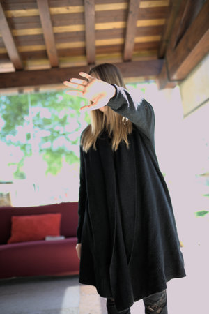 woman covers her face to handの写真素材