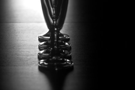 A silver trophy cup on a wooden table. Selective focus.の写真素材