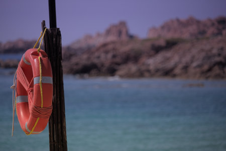 Lifebuoy on the shore of the Mediterranean Sea in Spain.