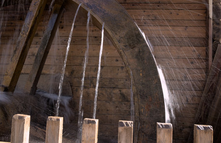 Water turbine in the old mill, close-up of water wheelの写真素材