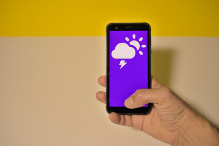 Weather forecast app on a smartphone. Weather forecast is one of the most popular social media icons in Malaysia.の写真素材
