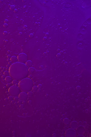 Purple water with bubbles. Abstract background and texture for design.