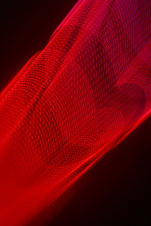 abstract red background with smooth lines and bokeh - technology backgroundの写真素材
