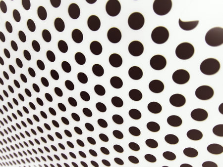 Abstract background of black dots on a white sheet of paper with a patternの写真素材