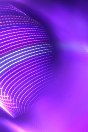 abstract background with motion blurred magic neon light curved lines and dotsの写真素材