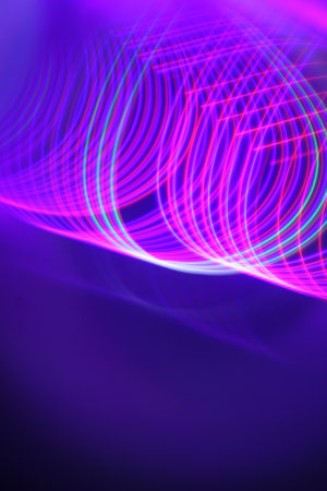 abstract background with glowing lines and bokeh in blue and purple