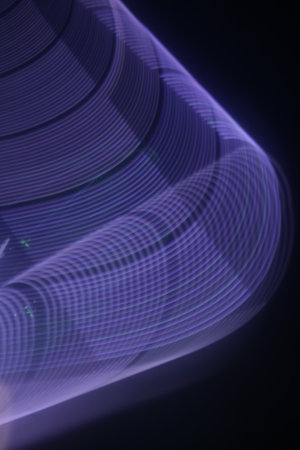 abstract background with smooth lines and bokeh in purple colors