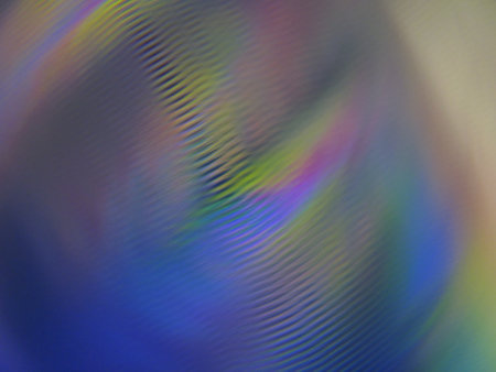 Vibrant abstract background with blurred traces of colored light effects.