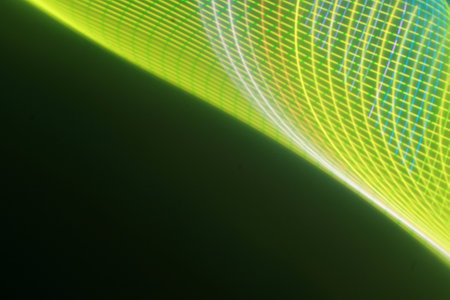 abstract background with motion blur green and yellow lines on black background