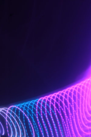 abstract background with glowing particles and lines in the form of waves