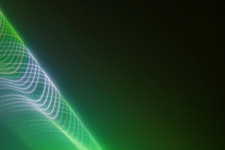 abstract background with green and blue glowing lines and particles in itの写真素材