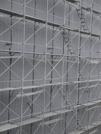 Metal scaffolding in a construction site, closeup of photo.