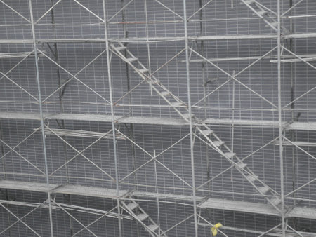 Metal scaffolding in the construction site, closeup of photo.