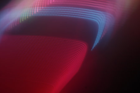 abstract background with motion blurred magic neon light lines and bokeh