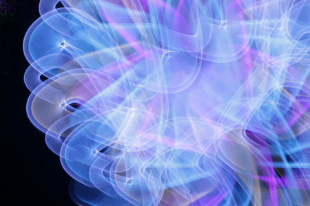 Abstract light painting in blue and purple colors on black background, computer generated