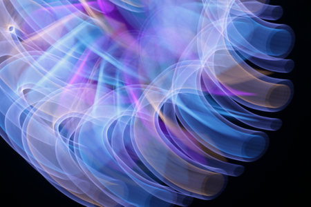 abstract background smoke curves in the dark and blue colors of the rainbow