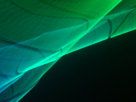 abstract background with a green and blue pattern of light lines.の写真素材