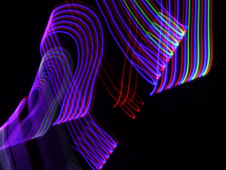 Colorful abstract light painting on black background. Abstract art background.