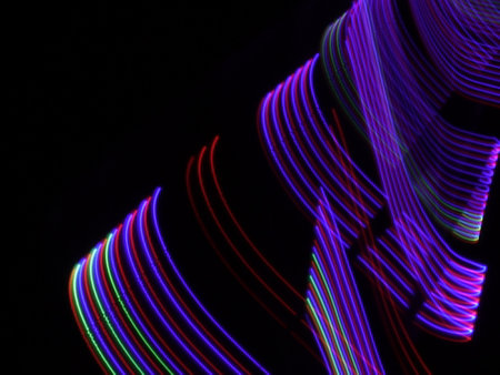 abstract background of colored lines with bokeh defocused lightsの写真素材