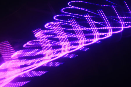 Abstract background of the luminous lines. Glowing spiral lines.