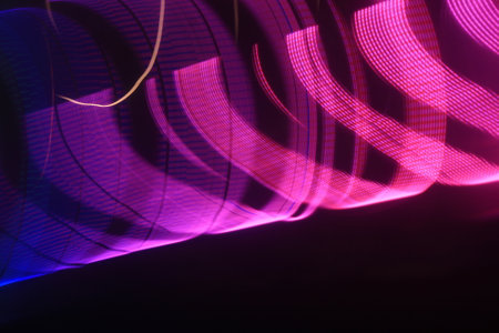 abstract background of the colored lights, glowing lines and bokehの写真素材