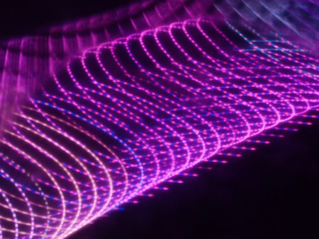 abstract background with a glowing particles in the form of a waveの写真素材