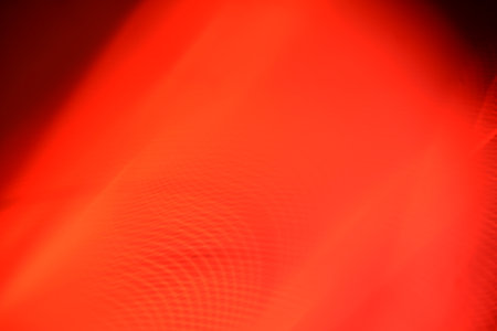 abstract red background with some smooth lines in it (defocused)の写真素材