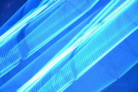 Application of comprehensive background light effects. Curved light lines background.