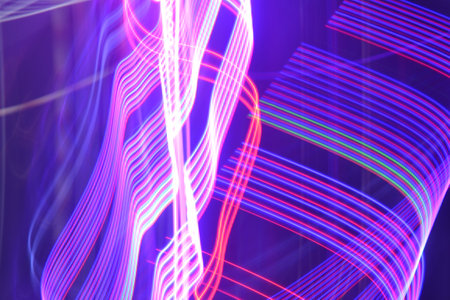 Abstract background of colorful neon lights. Long exposure photo taken in the studio.
