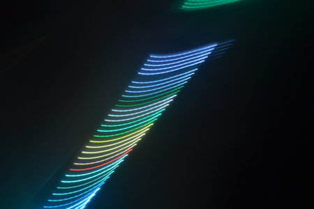 Colorful light trails on a black background, closeup of photoの写真素材