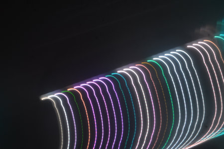 Neon light trails on a black background, closeup of photo