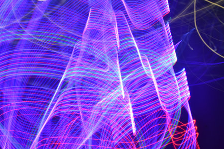 Abstract background of colorful lights. Long exposure photo. Motion blur.の写真素材