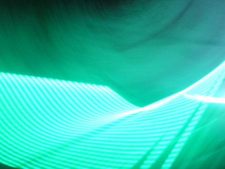 abstract background with glowing lines in green and turquoise colors