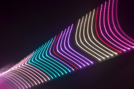 abstract background with colorful neon lines and bokeh defocused lightsの写真素材