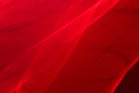 abstract red background texture with some smooth lines and folds in it