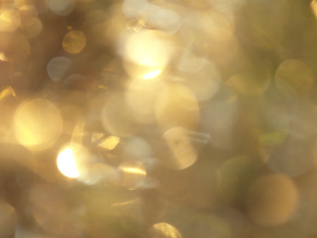 golden bokeh abstract background, defocused golden lights backgroundの写真素材