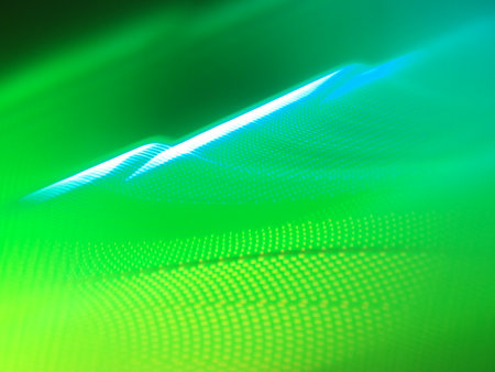 abstract background - glowing dots in the dark blue and green lightの写真素材