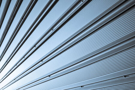 Steel metallic wall converging to a point on left cornerの写真素材
