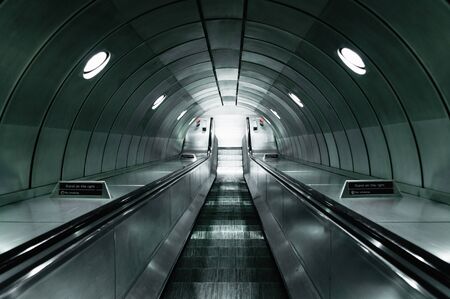 Staircase and escalator going down. London underground.の写真素材