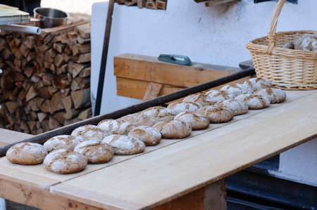 Loafs of bread baked using a traditional ovenの写真素材