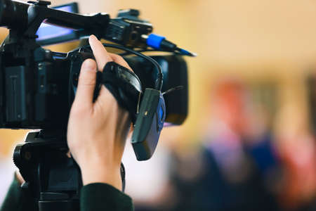Hand and videocamera
