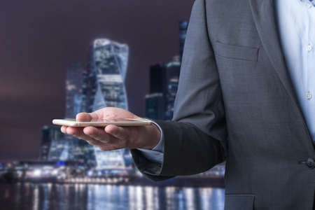 Businessman on city backgroundの写真素材